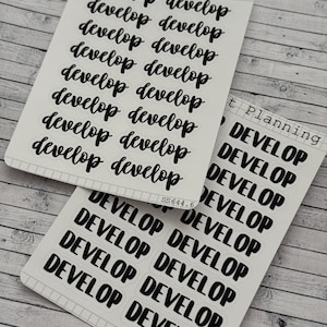 May include: Two sheets of clear sticker paper with black text. The top sheet has the words "Midnight Planning" and "develop" repeated 10 times. The bottom sheet has the word "DEVELOP" repeated 10 times. The bottom sheet also has the text "SS644.6" and "SS644" printed on it.