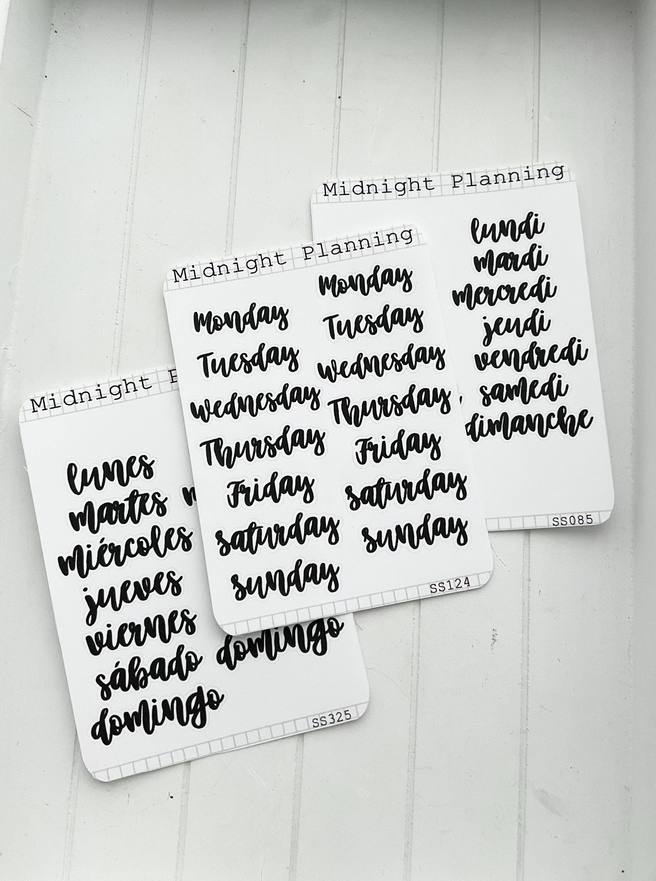 Women Hand writing Martes (Tuesday in Spanish) with black marker