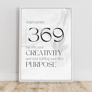 May include: Black and white printable art print with the text "angel number 369 tap into your CREATIVITY and start fulfilling your life's PURPOSE" on a white marble background.