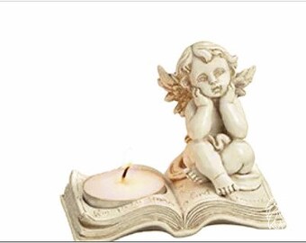 Tea light holder angel on book