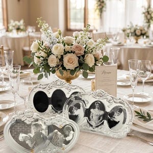 May include: Two ornate silver-toned picture frames with intricate scrollwork detailing. One frame is heart-shaped with two openings, and the other is an oval-shaped triple frame. Both frames contain black and white photographs of people.