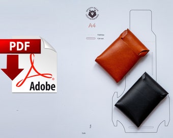 May include: A printable PDF pattern for a leather wallet. The pattern is on a white sheet of paper with a brown leather wallet and a black leather wallet on top of it. The pattern is labeled "A4" and includes fold lines and cut-out lines.