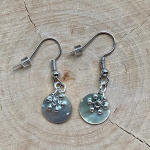 Mother of pearl earrings with silver star pendant