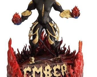 May include: A black and gold figurine of a creature with flames around the base. The creature is standing with its arms outstretched, holding flames in each hand. The base of the figurine has the word "EMBER" written on it.