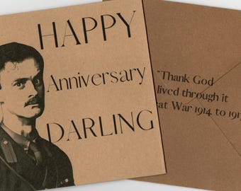 May include: A tan greeting card featuring a black and white illustration of a soldier in uniform with the text HAPPY Anniversary DARLING. Beside it, a matching tan envelope displays the text Thank God I lived through it at War 1914 to 1918.