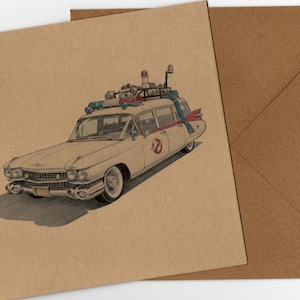 May include: A square greeting card made of brown kraft paper featuring a detailed illustration of a white vintage ambulance car with a roof rack, emergency lights, and a red and white ghost logo on the side door, accompanied by a matching envelope.