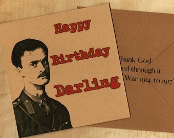 May include: A square tan greeting card featuring a black and white portrait of a man in a military uniform with the red text Happy Birthday Darling. A matching tan envelope is partially visible with the text Thank God I lived through it War 1914 to 1917.