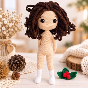 May include: A handmade crochet doll with light beige skin, dark brown curly hair, and black safety eyes. The doll is wearing white crocheted socks and has a simple, neutral expression. The figure is crafted with fine yarn stitches, showcasing a detailed texture throughout the body, hair, and socks, standing upright with arms positioned behind the back.