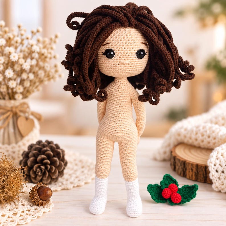 May include: A handmade crochet doll with light beige skin, dark brown curly hair, and black safety eyes. The doll is wearing white crocheted socks and has a simple, neutral expression. The figure is crafted with fine yarn stitches, showcasing a detailed texture throughout the body, hair, and socks, standing upright with arms positioned behind the back.