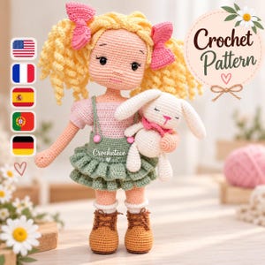 May include: A crocheted doll with curly yellow hair, pink bows, a pink top, and a green ruffled skirt with suspenders. The doll wears brown lace-up boots and holds a small white crocheted bunny. Text reads Crochet Pattern.