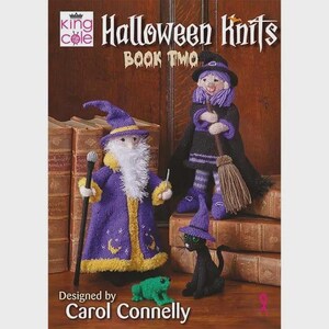 May include: A knitting pattern book titled Halloween Knits Book Two by Carol Connelly featuring a knitted wizard in a purple robe, a witch with a broomstick, a black cat in a purple hat, and a small green frog sitting on a wooden surface.