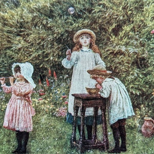 May include: An antique painting depicts three children in a garden. One child blows bubbles, another watches, and the third leans over a small table. The scene is set amidst lush greenery and colorful flowers, evoking a sense of childhood play.