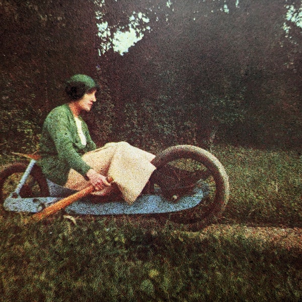 1980 J.H. Lartigue Autochromes Simone Roussel Sitting on My Two Wheeled "Bob" Rouzat 1913 ( Taken With Self-Timer)Approx. 10.75 x 9.5 Inches