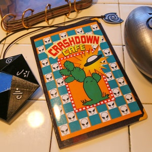 Roswell inspirierte Crashdown Café-Speisekarte (nur Cover).