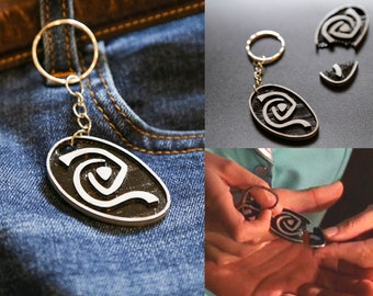 Roswell inspired Atherton's pendant keychain.