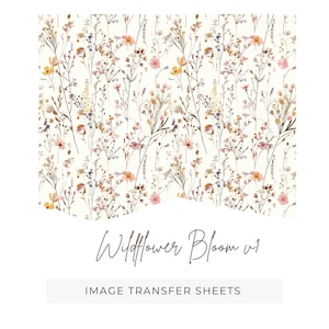 May include: A floral pattern featuring a cream background with delicate wildflowers in shades of pink, yellow, and brown. The text "Wildflower Bloom v1" is written in a cursive font. Below the floral pattern, the text "IMAGE TRANSFER SHEETS" is displayed.