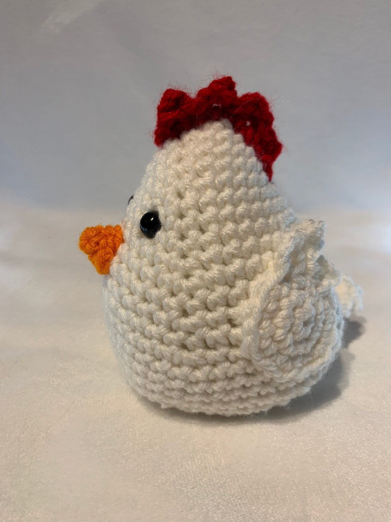 plush chicken with knife