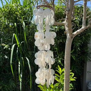 Wind chime made of shell garlands. Total length approx. 90 cm.