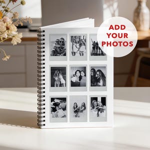 May include: A white spiral-bound notebook featuring a grid of nine black and white instant-style photographs on the front cover. A circular graphic overlay in the upper right corner contains the red text ADD YOUR PHOTOS in a bold sans-serif font.