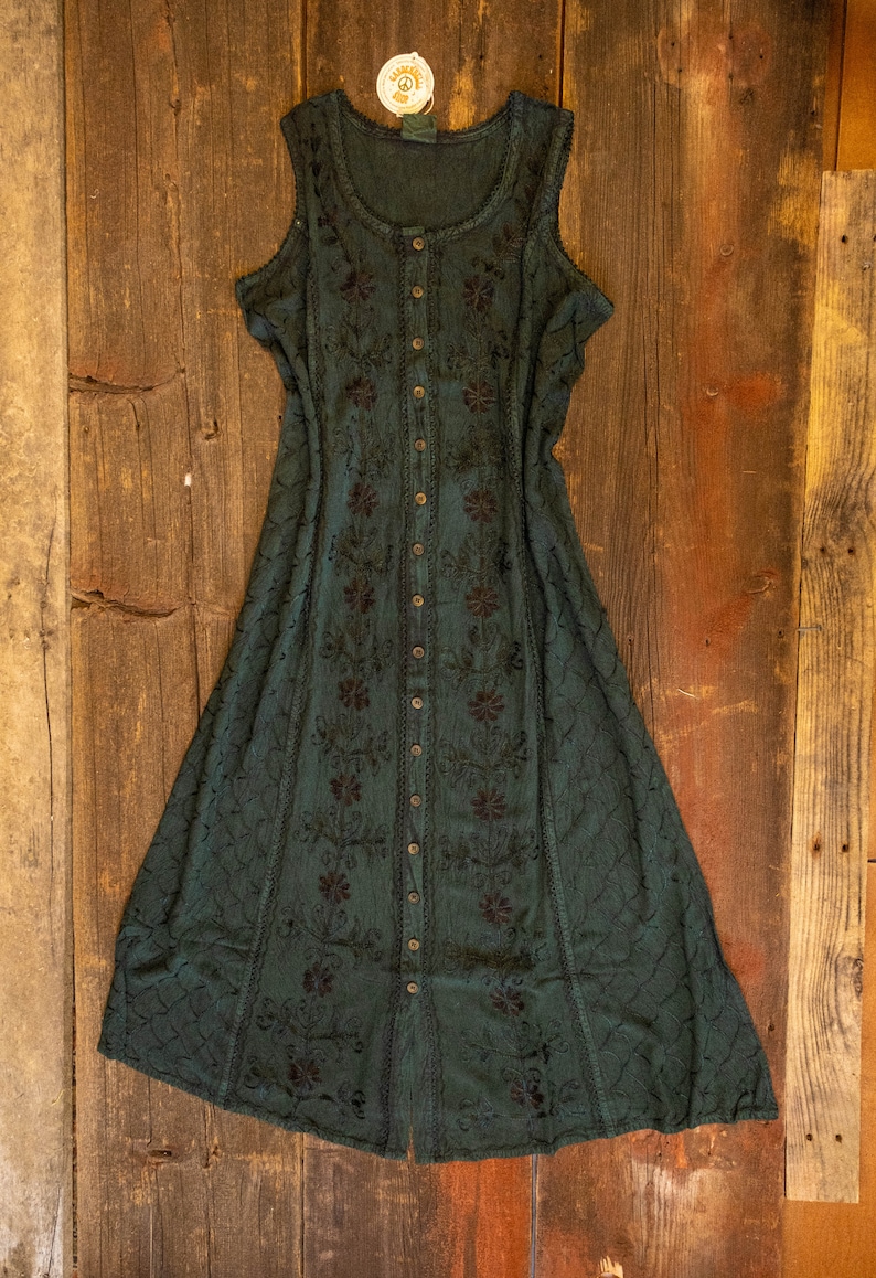 May include: A dark green sleeveless maxi dress with black embroidery and a button-up front.
