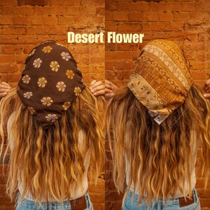 May include: Two women with long brown hair are wearing brown and tan patterned bandanas. The bandanas are tied around their heads and the text "Desert Flower" is printed above the image.
