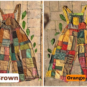 May include: Two patchwork overalls, one brown and one orange, with a variety of colors and patterns. The overalls are laid out on a tiled surface with green leaves scattered around them.