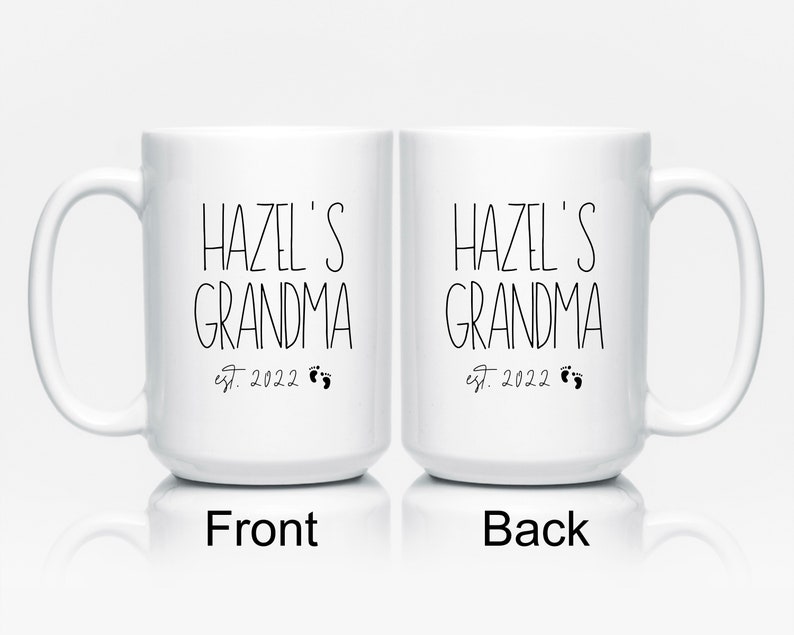 This grandma mug is personalized with the name of the baby and birth year. It reads from top to bottom, name of baby, grandma, established year with tiny baby feet. A bestseller, made in the USA using a high quality white lead free ceramic.