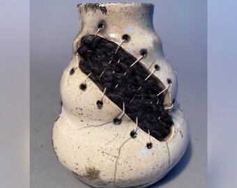 White Raku Vase with black yarn Weavings