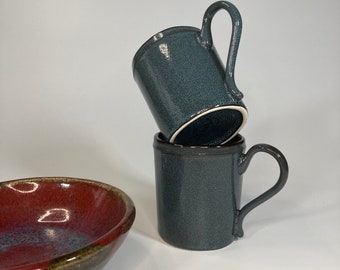 Set of 2 dark blue and black ceramic mugs by D&V (3.5”diax3.25")