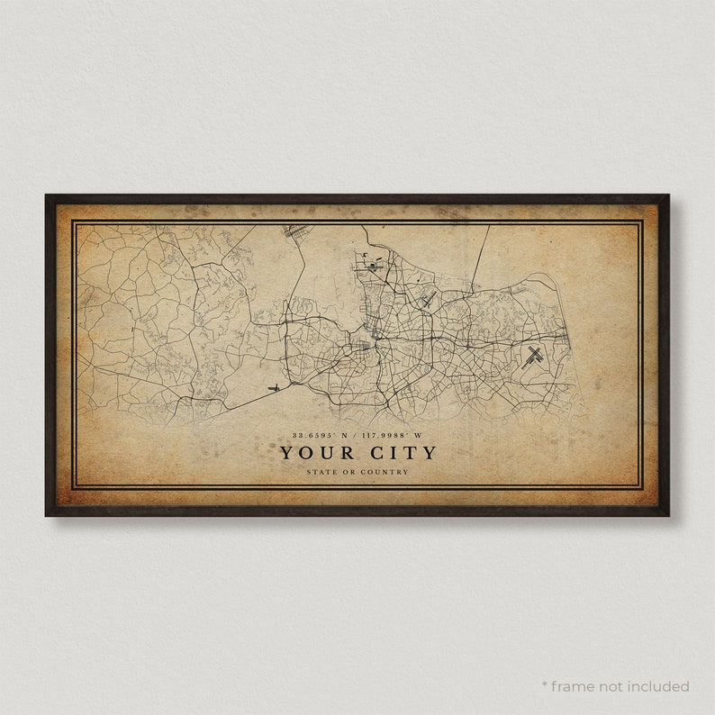 May include: A vintage-style map print of a city with a brown background and black lines. The map includes the coordinates 33.6395&deg; N / 117.0988&deg; W and the text "YOUR CITY STATE OR COUNTRY".