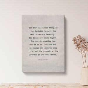 May include: A canvas print with a quote by Amelia Earhart: "The most difficult thing is the decision to act, the rest is merely tenacity. The fears are paper tigers. You can do anything you decide to do. You can act to change and control your life; and the procedure, the process is its own reward."