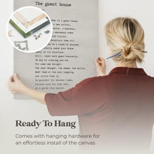 a woman writing on a piece of paper with the words ready to hang