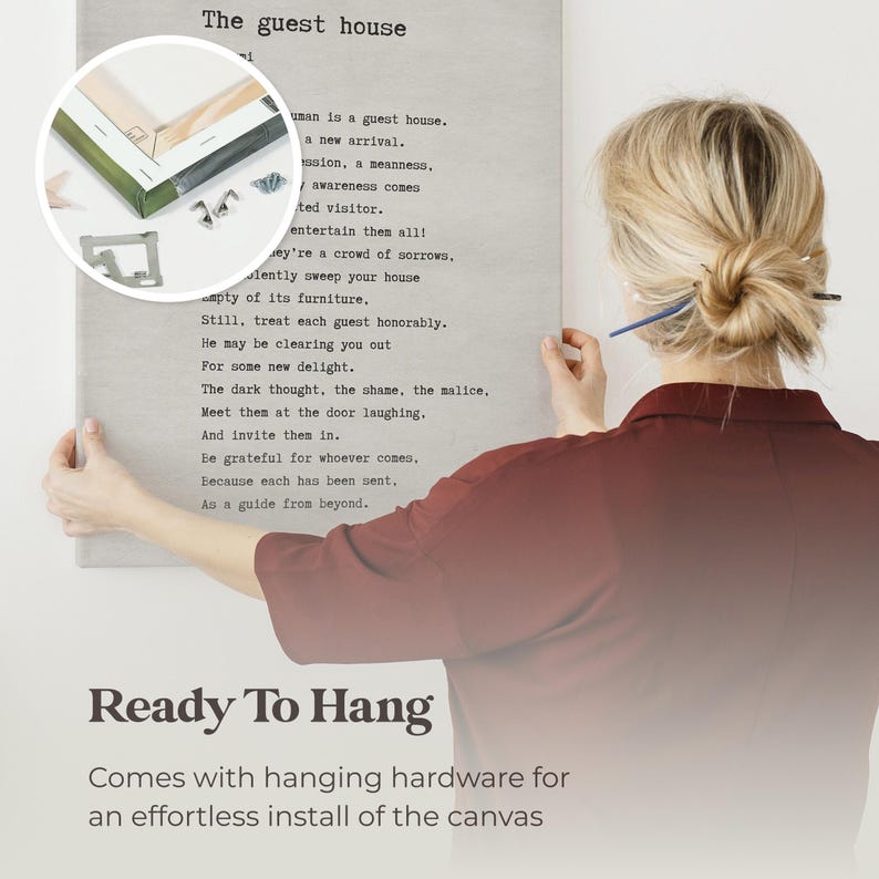 a woman writing on a piece of paper with the words ready to hang