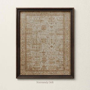 May include: A rectangular wall art piece featuring a faded, intricate pattern in shades of beige, cream, and muted gold, enclosed within a dark brown wooden frame. The artwork displays a detailed, symmetrical design with ornate borders.