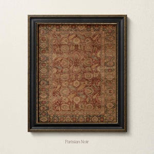 May include: A rectangular wall art piece featuring a detailed, intricate rug pattern in shades of deep red, muted gold, and dark blue, enclosed within a thick, black wooden frame with subtle gold-toned inner trim and the text Parisian Noir.