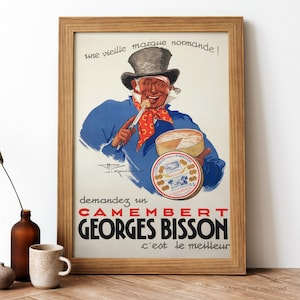 May include: Vintage French advertisement for Camembert cheese featuring a man in a blue jacket and top hat holding a round cheese box. The text reads "une vieille marque normandel demandez un CAMEMBERT GEORGES BISSON c'est le meilleur".