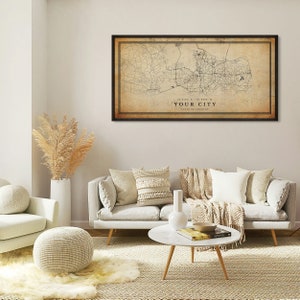 May include: A vintage-style map print of a city with roads and streets, framed in a black frame. The map is printed on a beige background with brown text that reads "YOUR CITY" and "STATE OR COUNTRY".