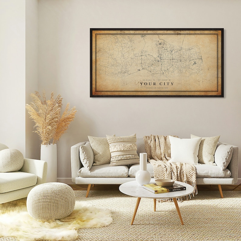 May include: A vintage-style map print of a city with roads and streets, framed in a black frame. The map is printed on a beige background with brown text that reads "YOUR CITY" and "STATE OR COUNTRY".