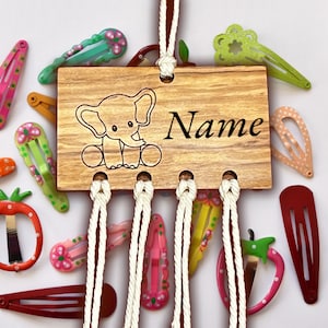 Hair clip holder made of olive wood can be personalized with different motifs and text of your choice