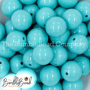 May include: A collection of light blue, glossy beads with a hole drilled through each. The beads are spherical and appear to be made of plastic. The BumbleBead Company logo is visible in the image.