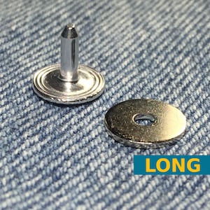 May include: A silver-colored metal rivet button with a long post and a separate circular backing washer. The button features a smooth, rounded top with concentric ring detailing. The text LONG is displayed in yellow on a blue rectangular background.