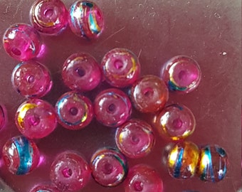 Perles rondes en verre rose et doré