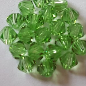 Swarovski crystal spinning tops 4mm Green - Chrysolite