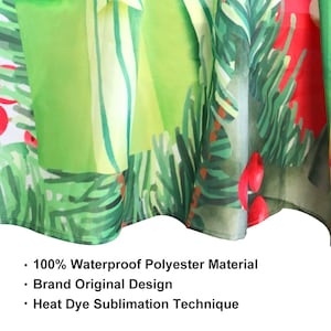 May include: Close-up of a green and red tablecloth with a Christmas tree design. The tablecloth is made of 100% waterproof polyester material and features a heat dye sublimation technique. The text "100% Waterproof Polyester Material", "Brand Original Design", and "Heat Dye Sublimation Technique" is visible at the bottom of the image.