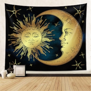 May include: A tapestry featuring a gold sun and moon on a dark blue background with stars. The sun and moon have faces and are drawn in a vintage style.
