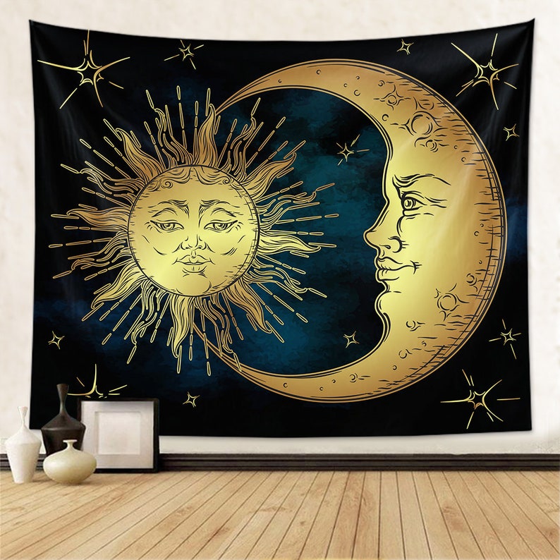 May include: A tapestry featuring a gold sun and moon on a dark blue background with stars. The sun and moon have faces and are drawn in a vintage style.