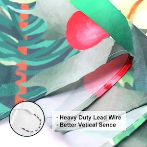 May include: Close-up of a green, red, and white patterned fabric with a white seam. The fabric has a heavy duty lead wire sewn into the seam for better vertical sense.