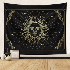 May include: Black tapestry with a gold sun with a face and rays emanating from it. The sun is surrounded by stars and clouds.