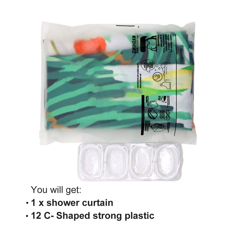 May include: A clear plastic bag containing a shower curtain with a tropical leaf pattern. The bag also includes a label with washing instructions.  A clear plastic tray with 12 C-shaped compartments is also shown. The text "You will get: 1 x shower curtain 12 C-Shaped strong plastic" is visible below the tray.
