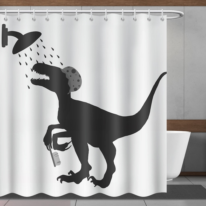 May include: A black and white shower curtain featuring a silhouette of a dinosaur with a shower cap on its head, holding a toothbrush. The dinosaur is standing in a shower with water droplets falling from the shower head.